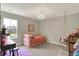 Bedroom with a swing chair, soft lighting, and decor for creating a relaxing and inviting atmosphere at 10237 Sand Run Ln, Fortville, IN 46040