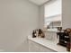 Butler Pantry with cabinets, countertops, and a window with natural light at 10237 Sand Run Ln, Fortville, IN 46040