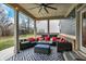 Comfortable covered patio area with outdoor seating and ceiling fan at 10237 Sand Run Ln, Fortville, IN 46040