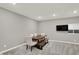 Bright dining area with modern table and chairs, and recessed lighting at 10237 Sand Run Ln, Fortville, IN 46040