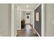 Warm entryway featuring hardwood floors and a view of the front door at 10237 Sand Run Ln, Fortville, IN 46040