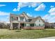 Beautiful home with dark shutters, a brick-lined foundation, and lush green grass at 10237 Sand Run Ln, Fortville, IN 46040