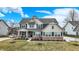Charming two-story home with well-kept lawn, inviting front porch, and ample parking space at 10237 Sand Run Ln, Fortville, IN 46040