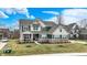 Charming two-story home with well-kept lawn, inviting front porch, and ample parking space at 10237 Sand Run Ln, Fortville, IN 46040