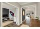 An interior hallway view showcases the open layout and multiple rooms, including an office, living room, and dining area at 10237 Sand Run Ln, Fortville, IN 46040