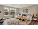 Comfortable living room with large windows, a cozy sectional sofa, and stylish decor at 10237 Sand Run Ln, Fortville, IN 46040
