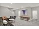 Inviting living room with plush seating, modern art, and neutral tones, creating a cozy and stylish atmosphere at 10237 Sand Run Ln, Fortville, IN 46040