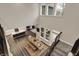 An aerial view of a bright living space highlights the dining area, kitchen, and open floor plan, perfect for modern living at 10237 Sand Run Ln, Fortville, IN 46040