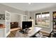 Bright home office with a custom desk, an open layout, and charming french doors at 10237 Sand Run Ln, Fortville, IN 46040