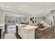 Open-concept living space flows to the kitchen and dining areas, creating a welcoming atmosphere at 10237 Sand Run Ln, Fortville, IN 46040