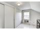Bedroom with a white walls, a window with an air conditioner, and a closet with sliding doors at 110 E Hendricks St, Shelbyville, IN 46176