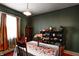 Cozy dining room featuring hardwood floors, and built-in shelving at 110 E Hendricks St, Shelbyville, IN 46176