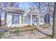 Charming two-story home features a well-manicured front yard and inviting front porch at 110 E Hendricks St, Shelbyville, IN 46176