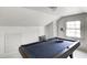 Game room featuring a pool table and a window for natural light at 110 E Hendricks St, Shelbyville, IN 46176