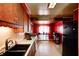 Kitchen with wooden cabinets, updated appliances, and bright natural light at 110 E Hendricks St, Shelbyville, IN 46176