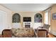 Inviting living room featuring a fireplace, built-in bookshelves, and comfortable seating at 110 E Hendricks St, Shelbyville, IN 46176