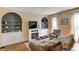 Comfortable seating area in living room with natural light and fireplace at 110 E Hendricks St, Shelbyville, IN 46176