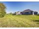 Expansive backyard view featuring a well-maintained lawn, deck, and exterior view of neighboring homes at 11598 Platt St, Noblesville, IN 46060