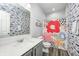 Stylish bathroom featuring patterned walls and shower curtains, a modern vanity, and neutral flooring at 11598 Platt St, Noblesville, IN 46060