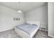 Bedroom featuring light gray walls, plush carpet, a modern bedframe, and overhead lighting at 11598 Platt St, Noblesville, IN 46060