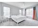 Bright bedroom with a white bed, neutral walls, and stylish window treatments at 11598 Platt St, Noblesville, IN 46060