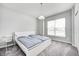 Bedroom with light gray walls, plush carpet, a modern bedframe and natural light from the window at 11598 Platt St, Noblesville, IN 46060