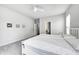 Comfortable bedroom featuring a large bed, neutral decor, and a view into an en-suite bathroom at 11598 Platt St, Noblesville, IN 46060