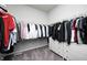 Walk-in closet featuring an organized storage system, multiple clothing racks and a built-in dresser at 11598 Platt St, Noblesville, IN 46060