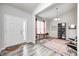 Inviting entryway featuring neutral paint, a colorful rug, and light wood flooring at 11598 Platt St, Noblesville, IN 46060