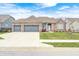 Charming brick home featuring a three-car garage, well-manicured lawn, and inviting curb appeal at 11598 Platt St, Noblesville, IN 46060