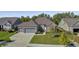 Charming brick home featuring a two-car garage, well-manicured lawn, and inviting front entrance at 11598 Platt St, Noblesville, IN 46060
