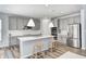 Beautiful kitchen with stainless steel appliances, white countertops, and a kitchen island with seating at 11598 Platt St, Noblesville, IN 46060