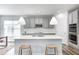 Bright kitchen featuring a central island, stainless appliances, and stylish pendant lighting at 11598 Platt St, Noblesville, IN 46060