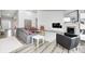 Open living room featuring a modern fireplace, stylish furnishings, and neutral decor at 11598 Platt St, Noblesville, IN 46060