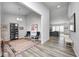 View of an open-concept living area with modern décor, light-colored flooring, and grey walls at 11598 Platt St, Noblesville, IN 46060