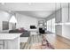 Stylish living room with modern decor and an adjacent kitchen featuring a large island at 11598 Platt St, Noblesville, IN 46060