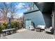 Cozy backyard featuring patio with fire pit, outdoor dining, and spiral staircase at 1238 Alabama St, Indianapolis, IN 46202