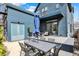 Inviting backyard with patio, outdoor dining, and a modern spiral staircase at 1238 Alabama St, Indianapolis, IN 46202