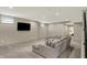 Spacious finished basement with plush carpeting and a comfortable sectional sofa at 1238 Alabama St, Indianapolis, IN 46202
