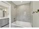Elegant bathroom featuring a tub with a shower head and a vanity with marble countertop at 1238 Alabama St, Indianapolis, IN 46202