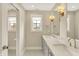 Modern bathroom with double vanity, granite countertops, and a view into the water closet at 1238 Alabama St, Indianapolis, IN 46202