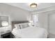 Well-lit bedroom with tufted headboard and neutral decor at 1238 Alabama St, Indianapolis, IN 46202