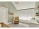 Bright Bedroom featuring chair, dresser, and window seat for peaceful moments at 1238 Alabama St, Indianapolis, IN 46202