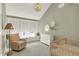 Cozy Bedroom featuring a window seat, crib, and natural light at 1238 Alabama St, Indianapolis, IN 46202