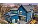 Backyard view showcasing a deck, outdoor seating, and spiral staircase leading to a rooftop terrace at 1238 Alabama St, Indianapolis, IN 46202