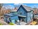 Exterior view of the blue home featuring decks, sliding doors, and a staircase at 1238 Alabama St, Indianapolis, IN 46202