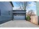 Close up of the detached two-car garage with modern overhead pergola at 1238 Alabama St, Indianapolis, IN 46202