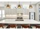 Spacious kitchen with a center island, pendant lighting, stainless steel appliances, and bar stool seating at 1238 Alabama St, Indianapolis, IN 46202