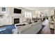 Bright living room features a fireplace, hardwood floors, and an open layout to the kitchen and dining area at 1238 Alabama St, Indianapolis, IN 46202