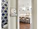 Stylish powder room is visible through the kitchen with modern fixtures, bright lighting and tasteful decor at 1238 Alabama St, Indianapolis, IN 46202